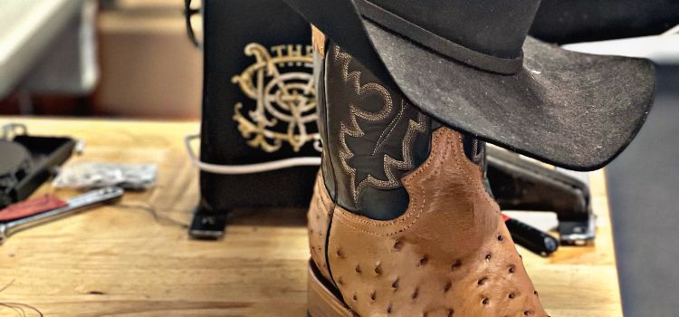 A Custom Cowboy Boot That Someone Invested In Posed With A Cowboy Hat