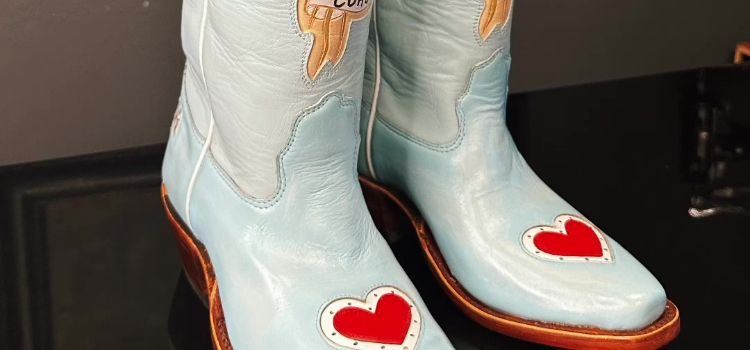 A pair of new custom cowboy boots that need breaking in.